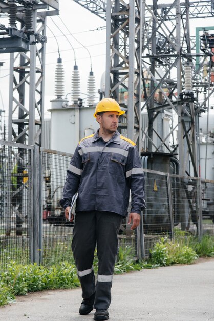 engineering-employee-makes-tour-inspection-modern-electrical-substation_180601-8643